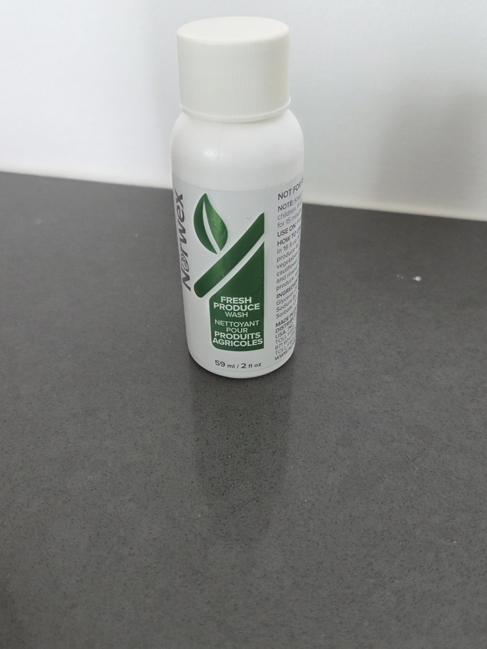 Norwex White Bottle with Green Leaf Label